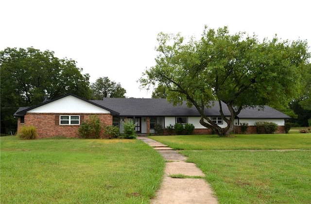 ranch-style home with a front yard