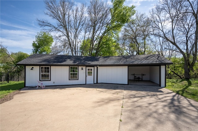 ranch-style home featuring a carport