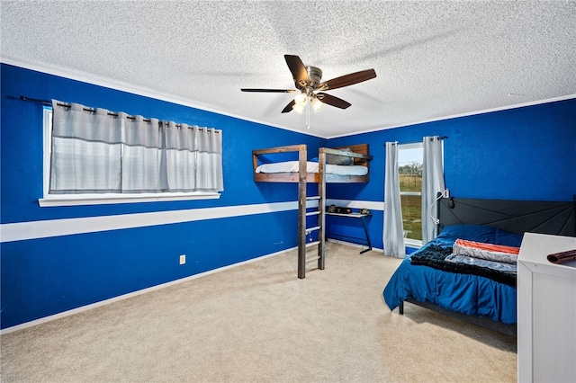 bedroom featuring a textured ceiling, ceiling fan, and light carpet