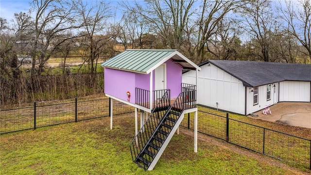 view of outbuilding with a yard