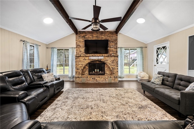 living room with a fireplace, vaulted ceiling with beams, and dark hardwood / wood-style floors