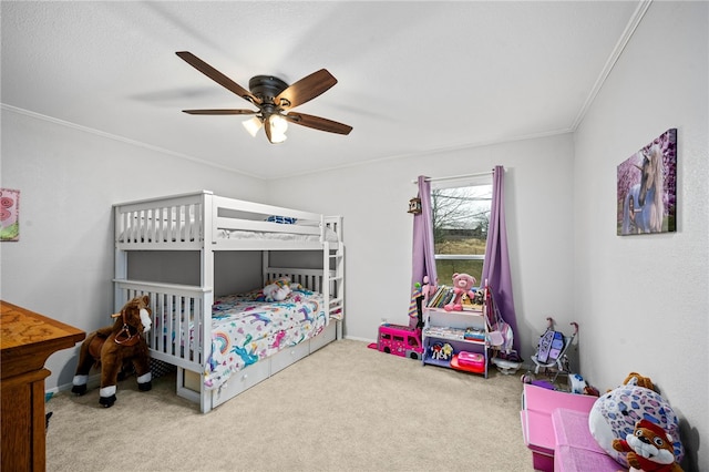 bedroom featuring carpet, ceiling fan, and crown molding