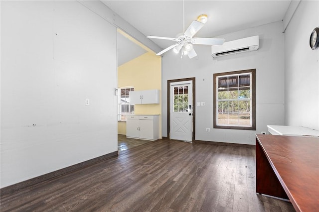 interior space with ceiling fan, dark hardwood / wood-style flooring, an AC wall unit, and high vaulted ceiling