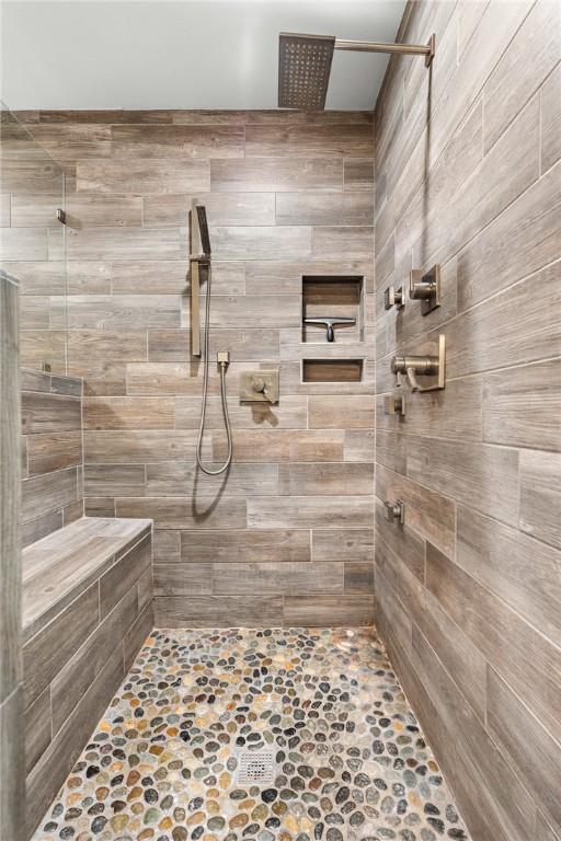 bathroom with a tile shower