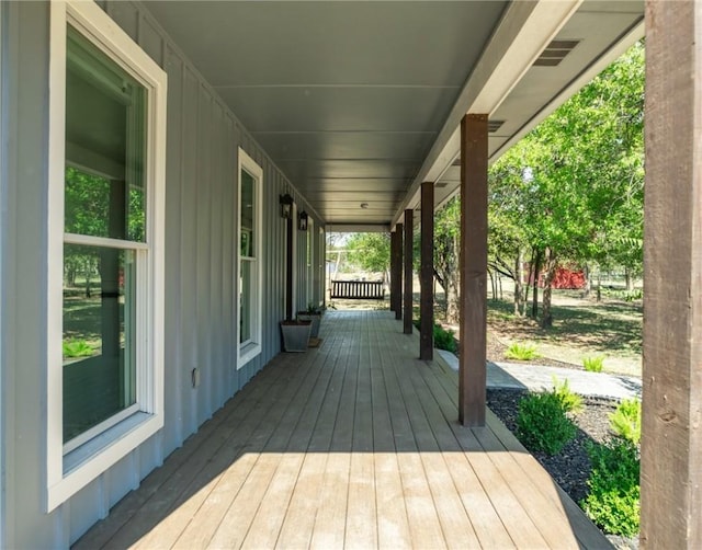 wooden terrace with covered porch