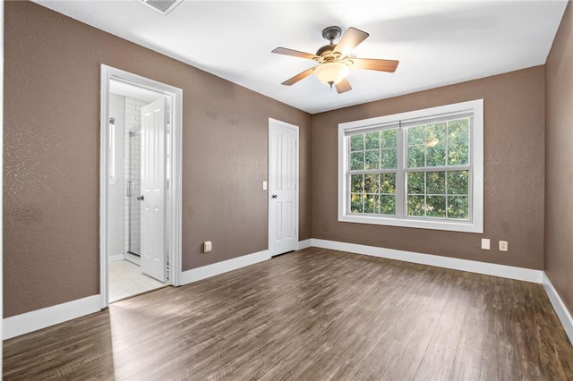 spare room featuring ceiling fan and hardwood / wood-style flooring