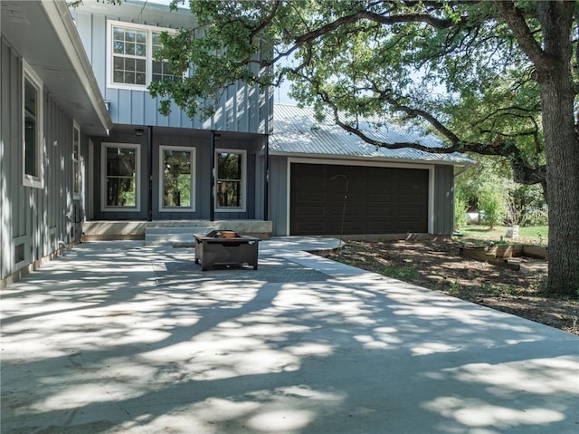 exterior space featuring an outdoor fire pit