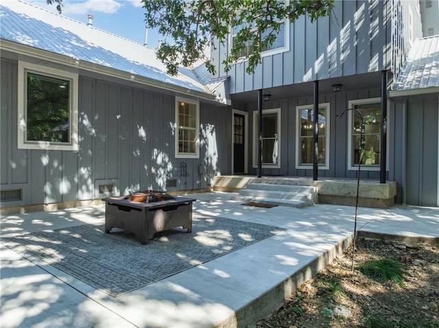 view of patio with a fire pit