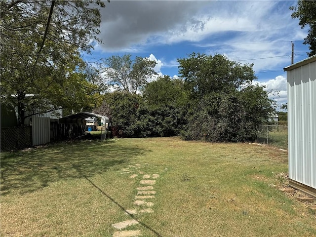 view of yard featuring a carport