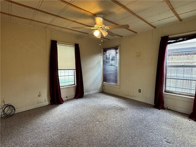 spare room featuring ceiling fan and light colored carpet