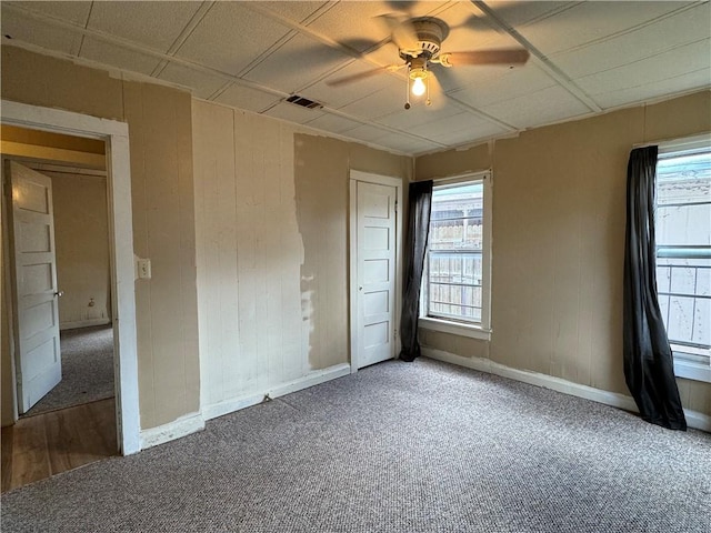 spare room with ceiling fan and carpet floors