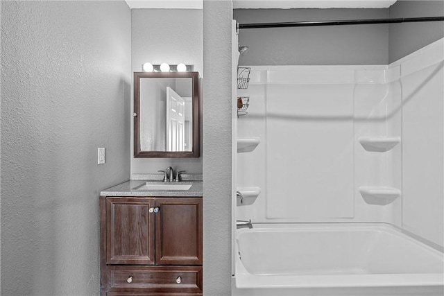 bathroom with bathtub / shower combination and vanity