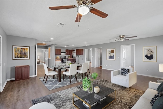 living room with dark hardwood / wood-style flooring