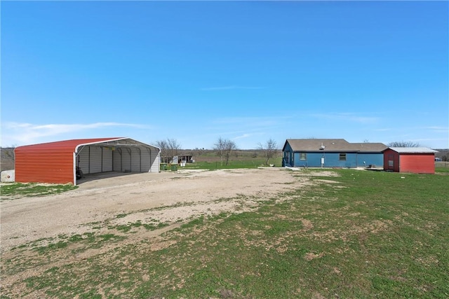 view of yard with a carport