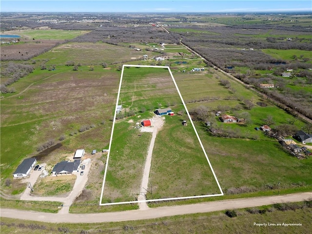 birds eye view of property featuring a rural view