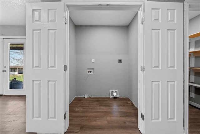 laundry room featuring hookup for an electric dryer, a textured ceiling, and washer hookup