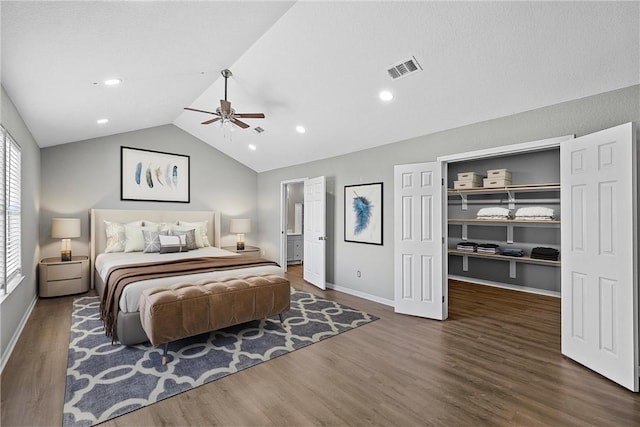 bedroom featuring dark hardwood / wood-style floors, ceiling fan, and lofted ceiling