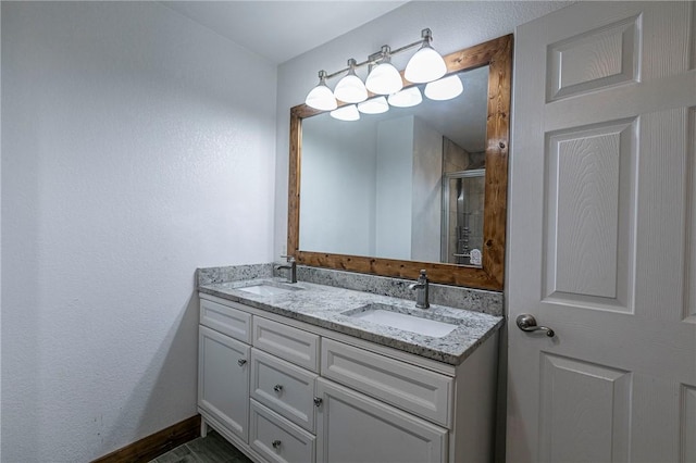 bathroom with vanity and an enclosed shower