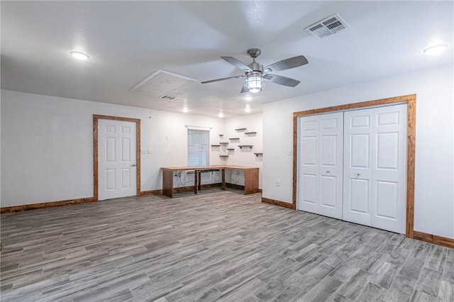 interior space with ceiling fan and light hardwood / wood-style flooring