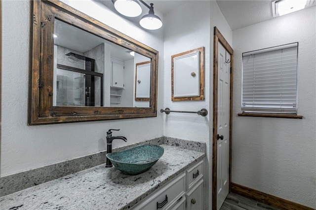 bathroom featuring vanity and wood-type flooring