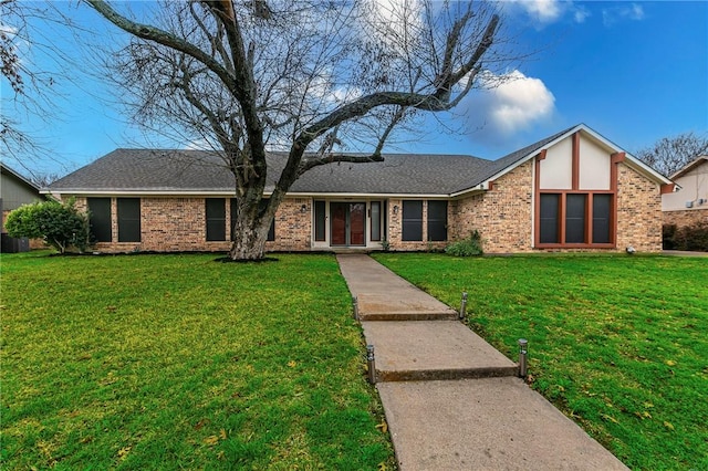 ranch-style house with a front lawn