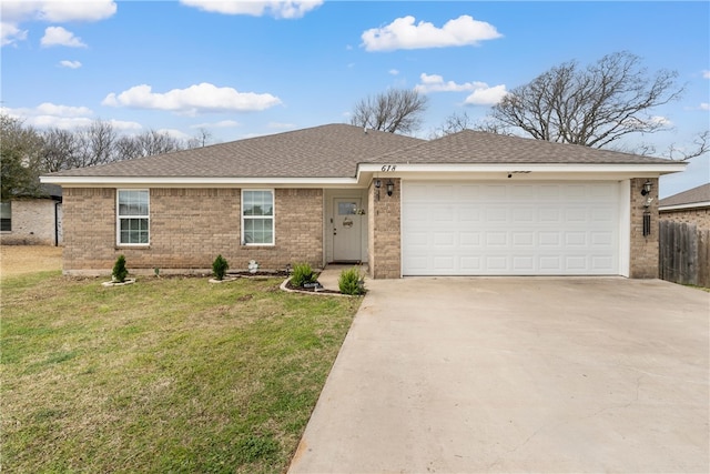 ranch-style house featuring a shingled roof, fence, a front yard, driveway, and an attached garage