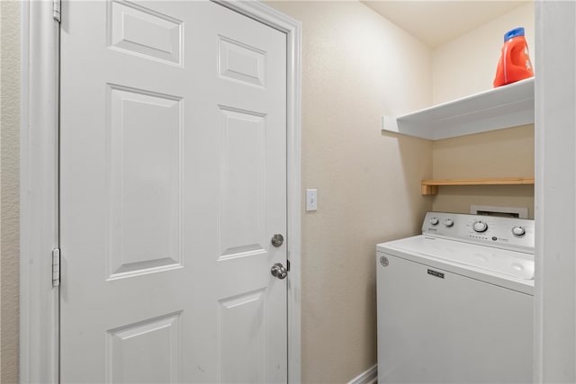 laundry area featuring washer / dryer and laundry area