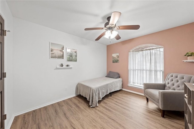 bedroom featuring ceiling fan and light hardwood / wood-style flooring