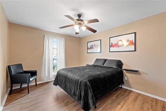 bedroom featuring light hardwood / wood-style flooring and ceiling fan