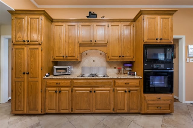 kitchen with black appliances, light tile patterned floors, crown molding, and tasteful backsplash