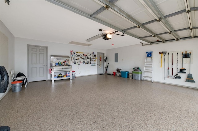 garage with electric panel and a garage door opener