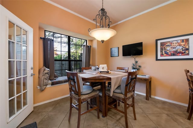 tiled dining space with french doors and ornamental molding