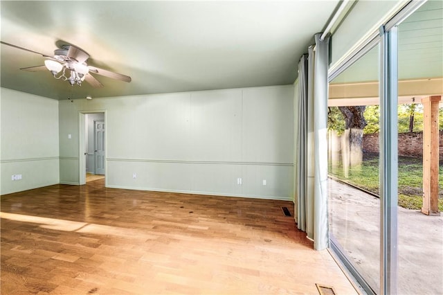 unfurnished room featuring ceiling fan and hardwood / wood-style flooring