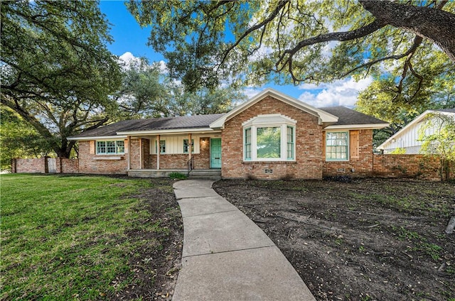 ranch-style home with a front lawn