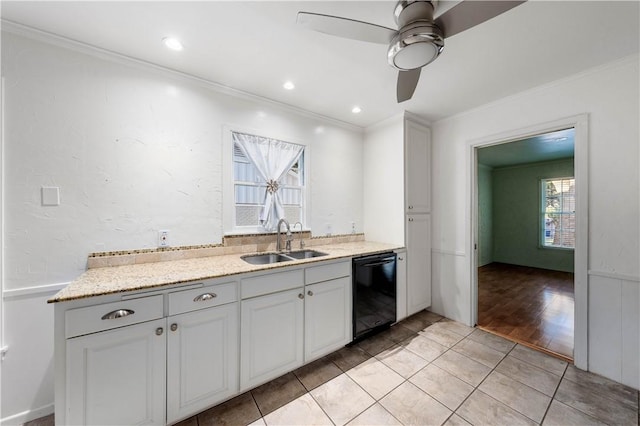 kitchen featuring ceiling fan, dishwasher, sink, crown molding, and light hardwood / wood-style floors