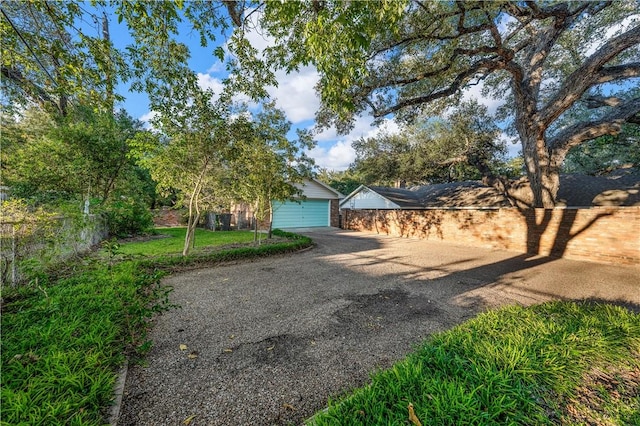 view of front of house featuring a garage and an outdoor structure