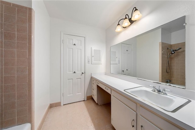 bathroom featuring tile patterned flooring and vanity