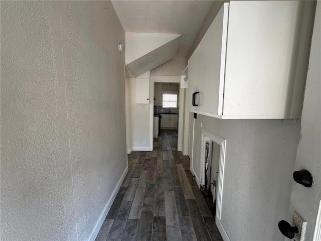 corridor featuring dark hardwood / wood-style flooring