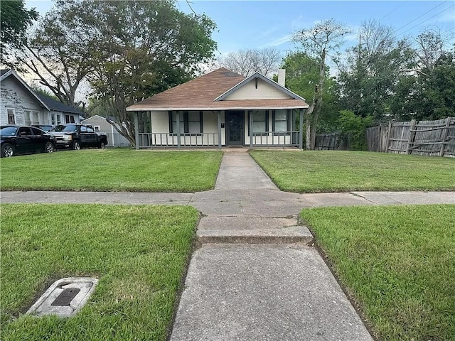 bungalow-style home featuring a porch and a front lawn