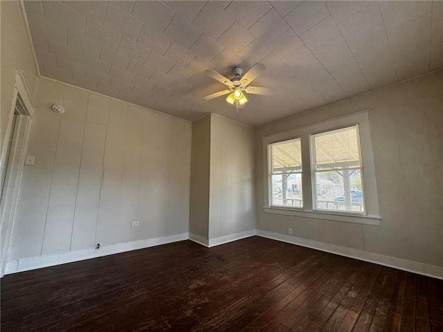 unfurnished room featuring dark hardwood / wood-style floors and ceiling fan