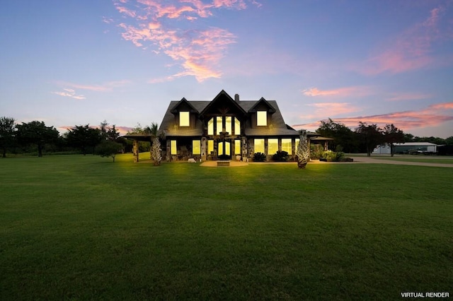 view of front of home with a yard