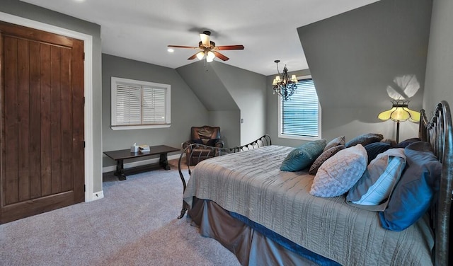 bedroom featuring carpet, ceiling fan with notable chandelier, and vaulted ceiling