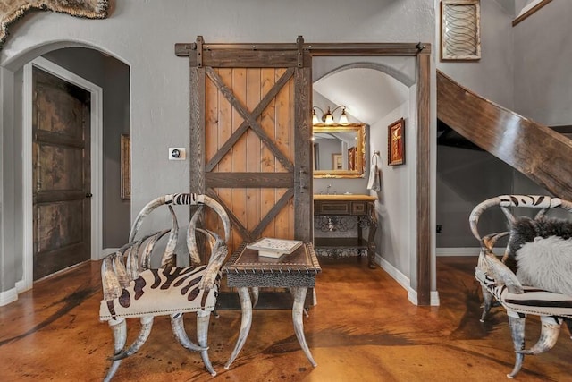 living area featuring a barn door