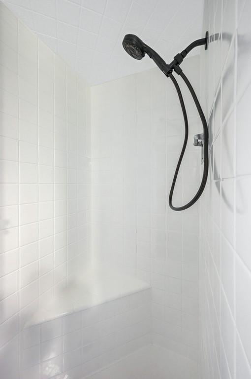 details with a tile shower