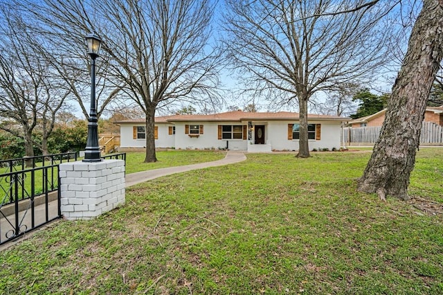 rear view of house with a lawn