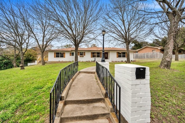 view of front of home with a front lawn