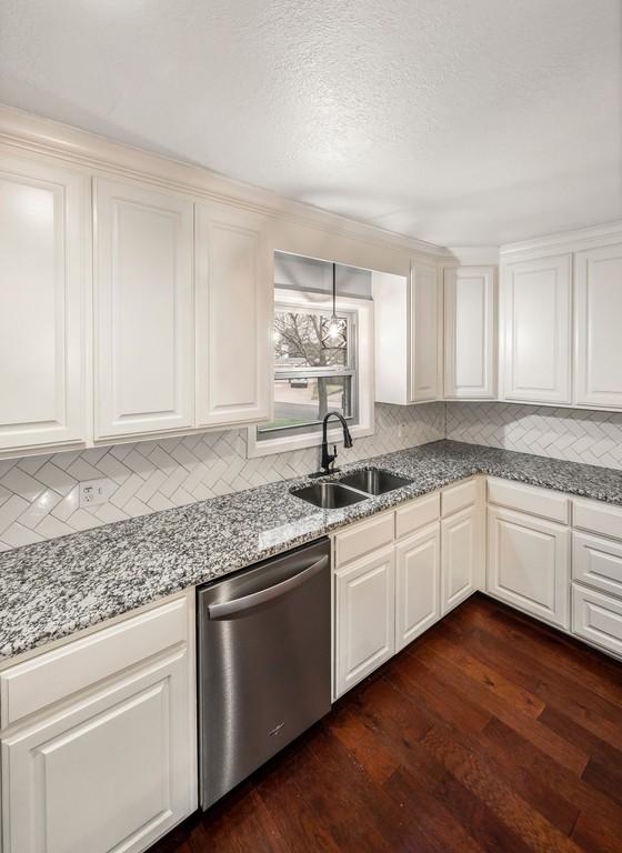 kitchen featuring decorative backsplash, dishwasher, dark hardwood / wood-style floors, and sink