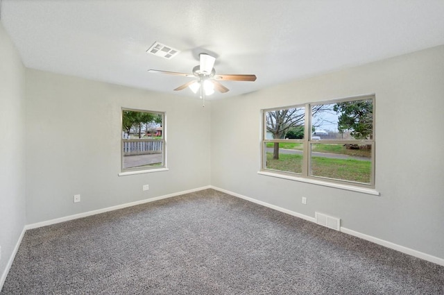 unfurnished room with carpet and ceiling fan