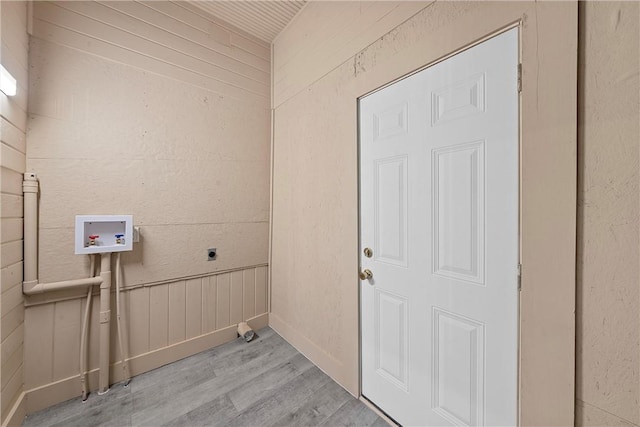 laundry area featuring hookup for an electric dryer, hookup for a washing machine, and light hardwood / wood-style flooring