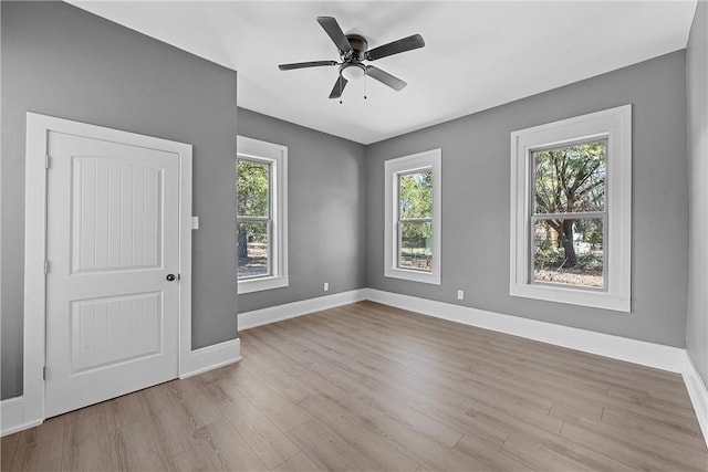 empty room featuring ceiling fan and light wood-type flooring